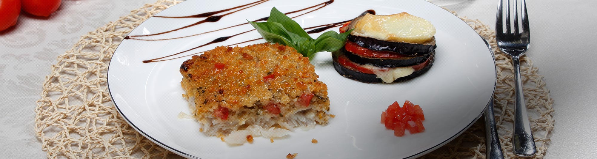 Merluzzo Gratinato al Pomodoro e millefoglie di melanzana e provola