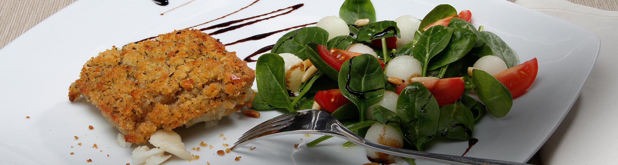 Merluzzo Gratinato con Erbe Mediterranee e mix di spinaci e melone